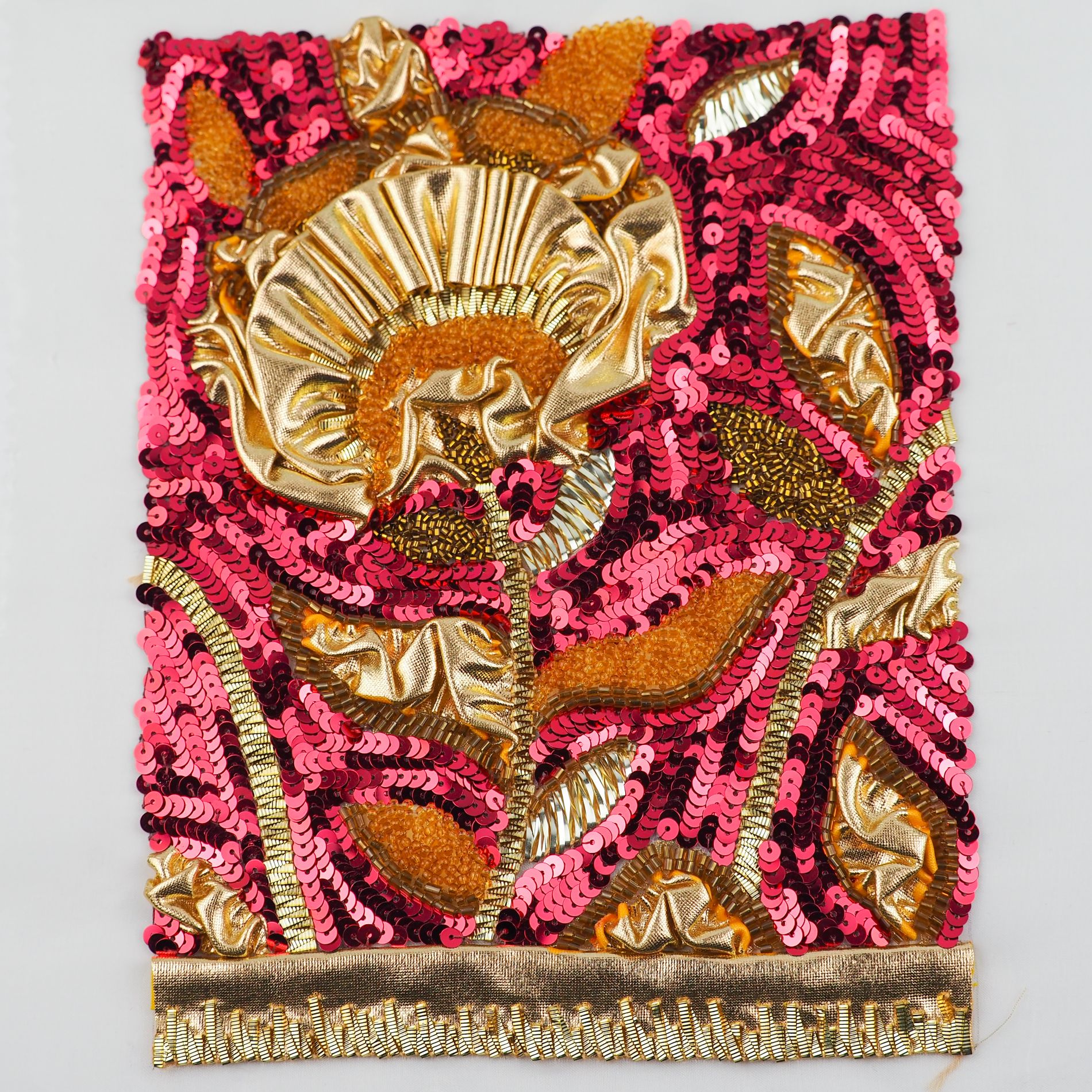 Dior 1986–1987 Marc Bohan Couture Embroidery Study Couture embroidery sample inspired by Christian Dior Haute Couture Autumn–Winter 1986–1987 by Marc Bohan, featuring sculpted gold fabric and dense pink and gold sequin embroidery.