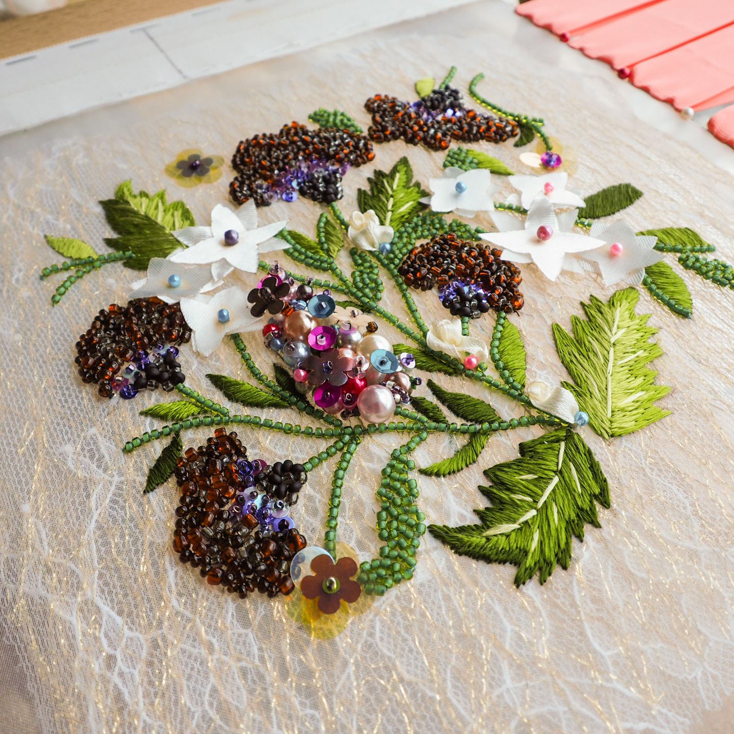 Georges Hobeika Couture 2016 Luneville Embroidery Study Luneville embroidery sample inspired by Georges Hobeika Couture Fall 2016, featuring layered beads, sequins, fabric flowers, raised berry clusters, and shaded green leaves on tulle.