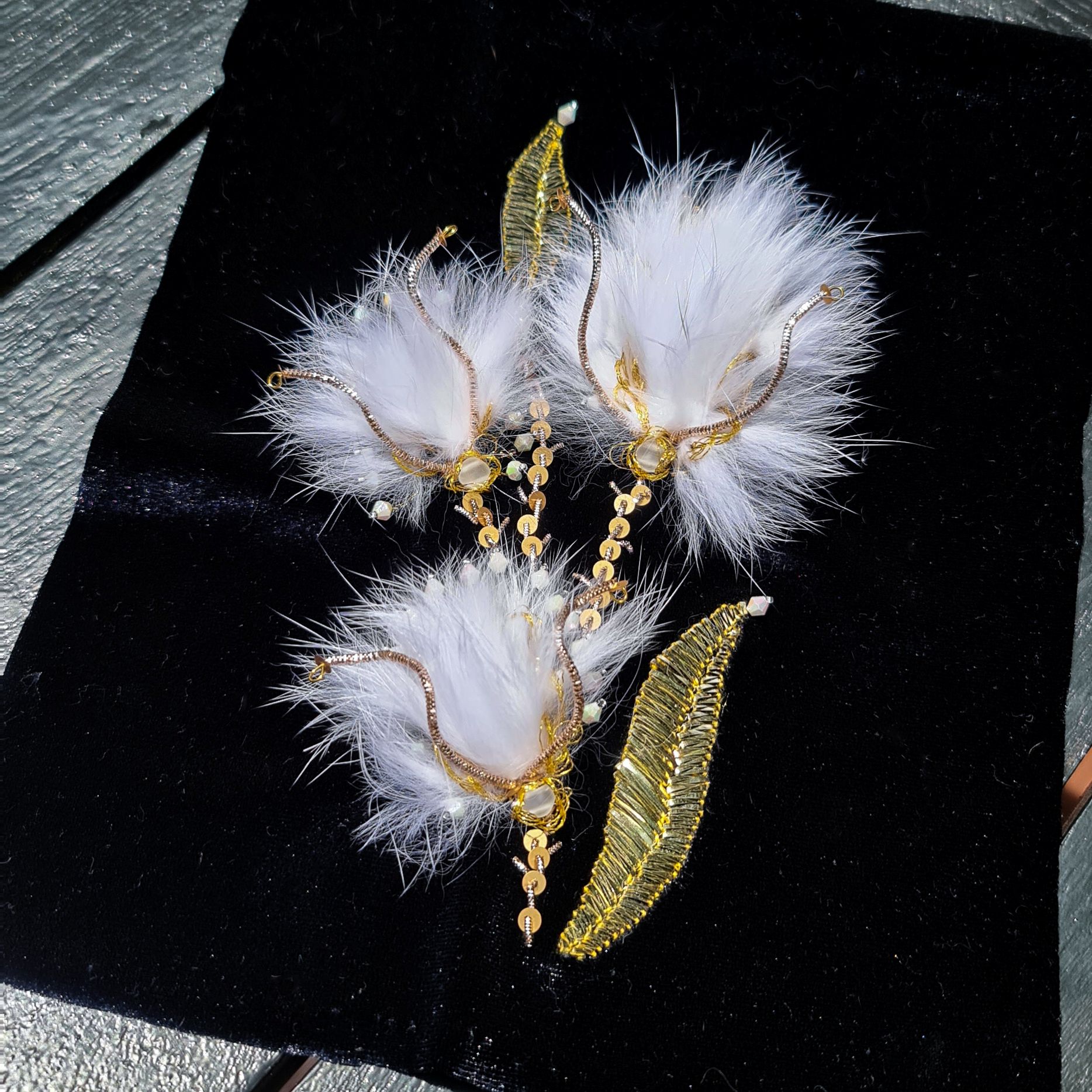 Jacques Fath 1951 Couture Embroidery Study Couture embroidery sample inspired by a 1951 Jacques Fath ball gown, featuring white faux-fur tufts, pearls, and gold metallic embroidery on dark velvet.