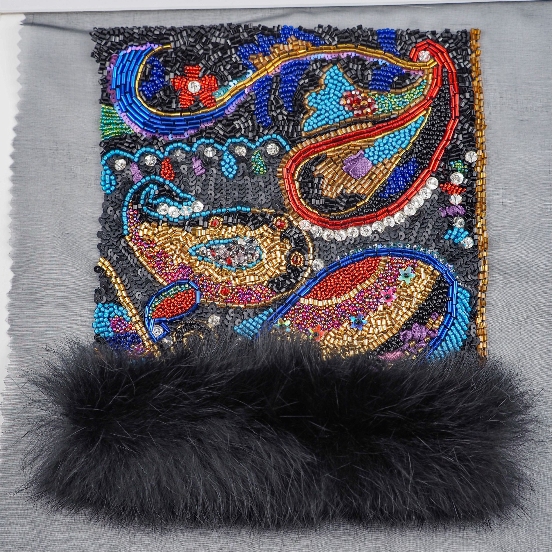 Oscar de la Renta 1987–88 Couture Embroidery Study Luneville embroidery sample inspired by an Oscar de la Renta Fall/Winter 1987–88 bolero, featuring dense paisley motifs stitched with sequins, beads, bugles and finished with black fur trim.