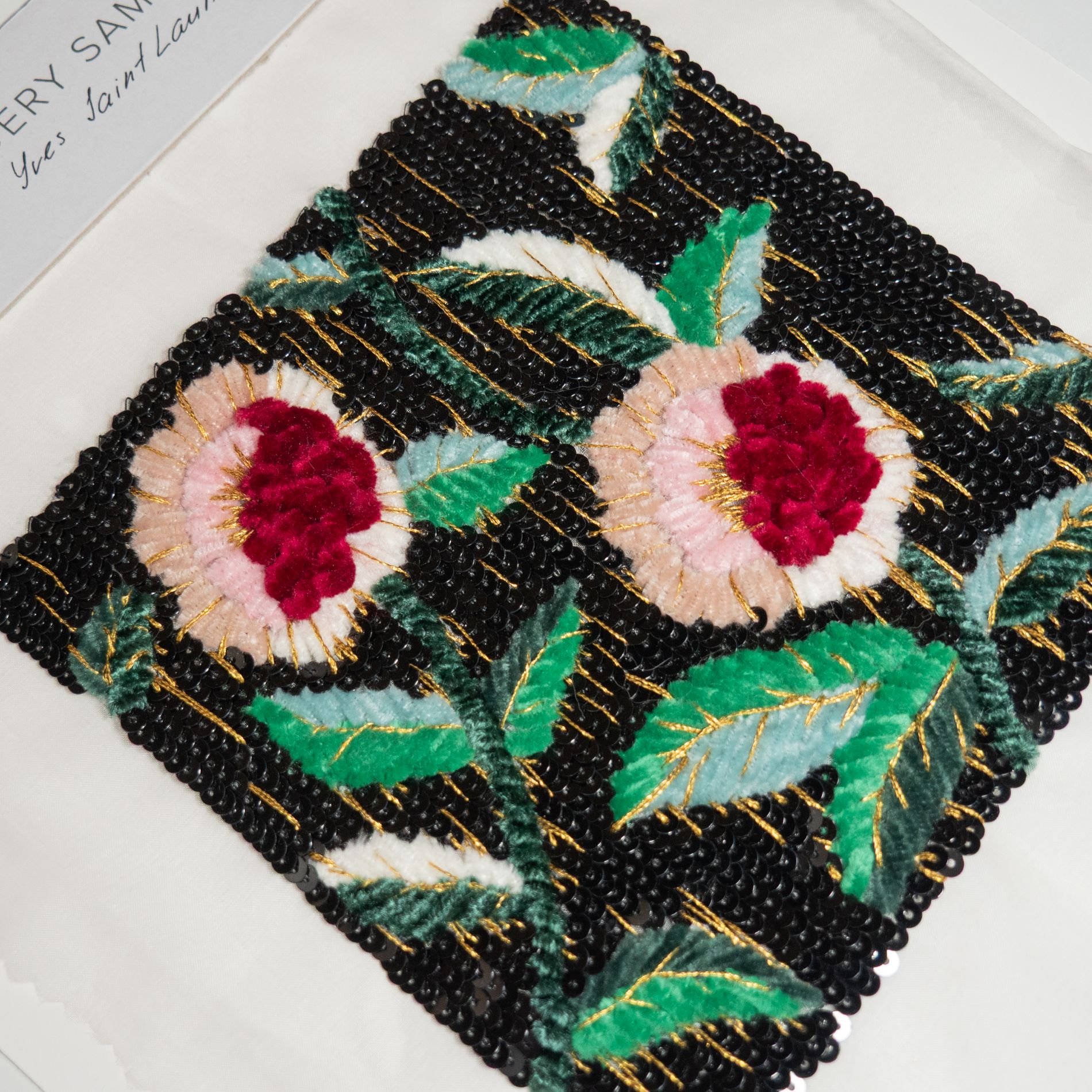 YSL 1974 Lesage Floral Embroidery Study Sample Hand-embroidered sample inspired by a Yves Saint Laurent Haute Couture 1974–1975 dress, featuring velvet floral appliqué, black sequin background, and gold-thread detailing.