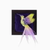 Flying Hummingbird Lime Green and Purple Textile Wall Art and Brooch – 3D embroidered hummingbird handcrafted in lime green and purple silk, adorned with beads and sequins, detachable as a wearable brooch, displayed on a deep velvet background