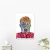 Home Alone Kevin embroidery art poster featuring a vibrant, colorful abstract portrayal of Kevin's iconic shocked expression, displayed on a white wall above a wooden table with minimalist decor | Christmas Movie Wall Art Print