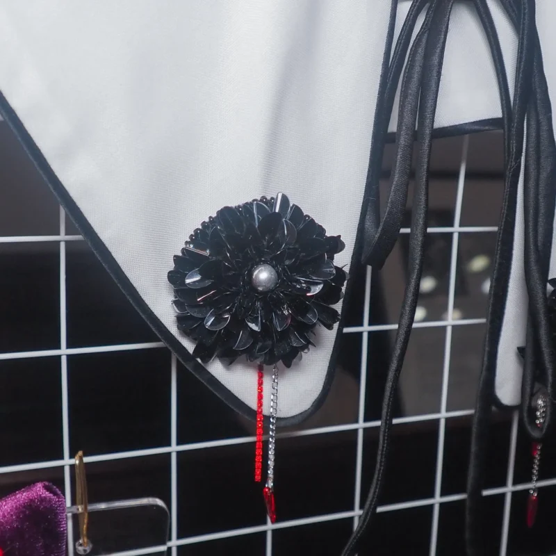 Black Dahlia Brooch with hand-embroidered black sequins and a blood-red rhinestone chain, designed for gothic fashion enthusiasts. Handcrafted luxury gothic jewelry