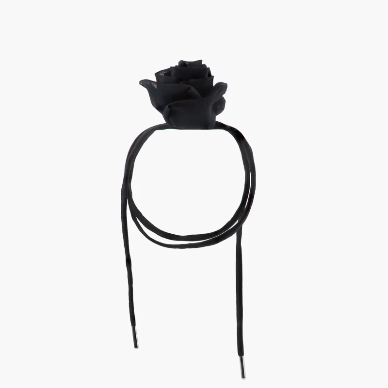 Side view of adjustable satin lace closure on black silk rose choker necklace