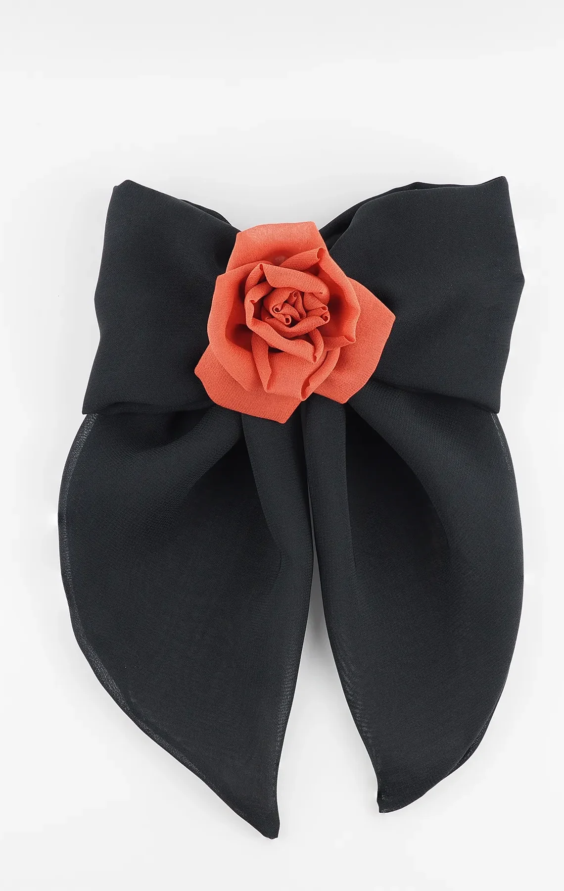 A handmade hair clip featuring a large black chiffon bow measuring approximately 16x25 cm, adorned at the center with a single red silk rose about 6 cm in diameter. The accessory combines bold black and vibrant red colors, showcasing elegant craftsmanship suitable for gothic fashion or evening wear.