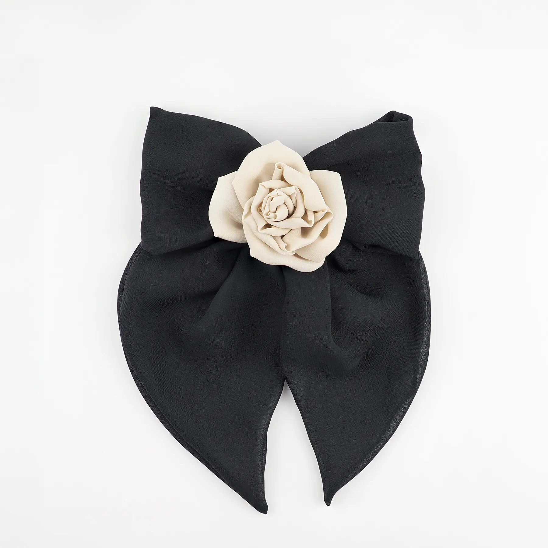 Front view of a black chiffon bow hair clip featuring a handmade nude chiffon rose centerpiece, ideal for stylish and versatile hair looks