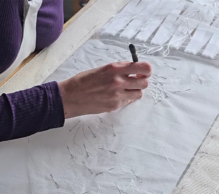 tambour lace embroidery in progress ksenia semirova | Ksenia Semirova. Embroidery art Close-up of tambour embroidery in progress, using a hook to stitch white thread on fine tulle for a bespoke wedding veil.