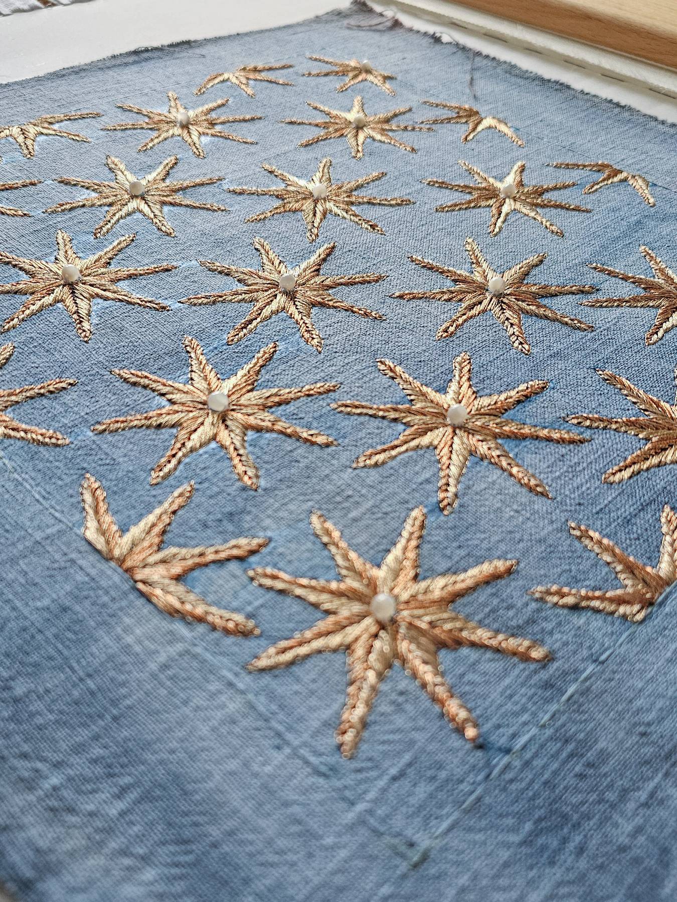 Cosplay Embroidery Commission Gold Star Detail on Blue Fabric | Ksenia Semirova. Embroidery art Hand embroidered gold star motif with pearl detail on blue fabric, created for cosplay embroidery commission and competition costume accuracy