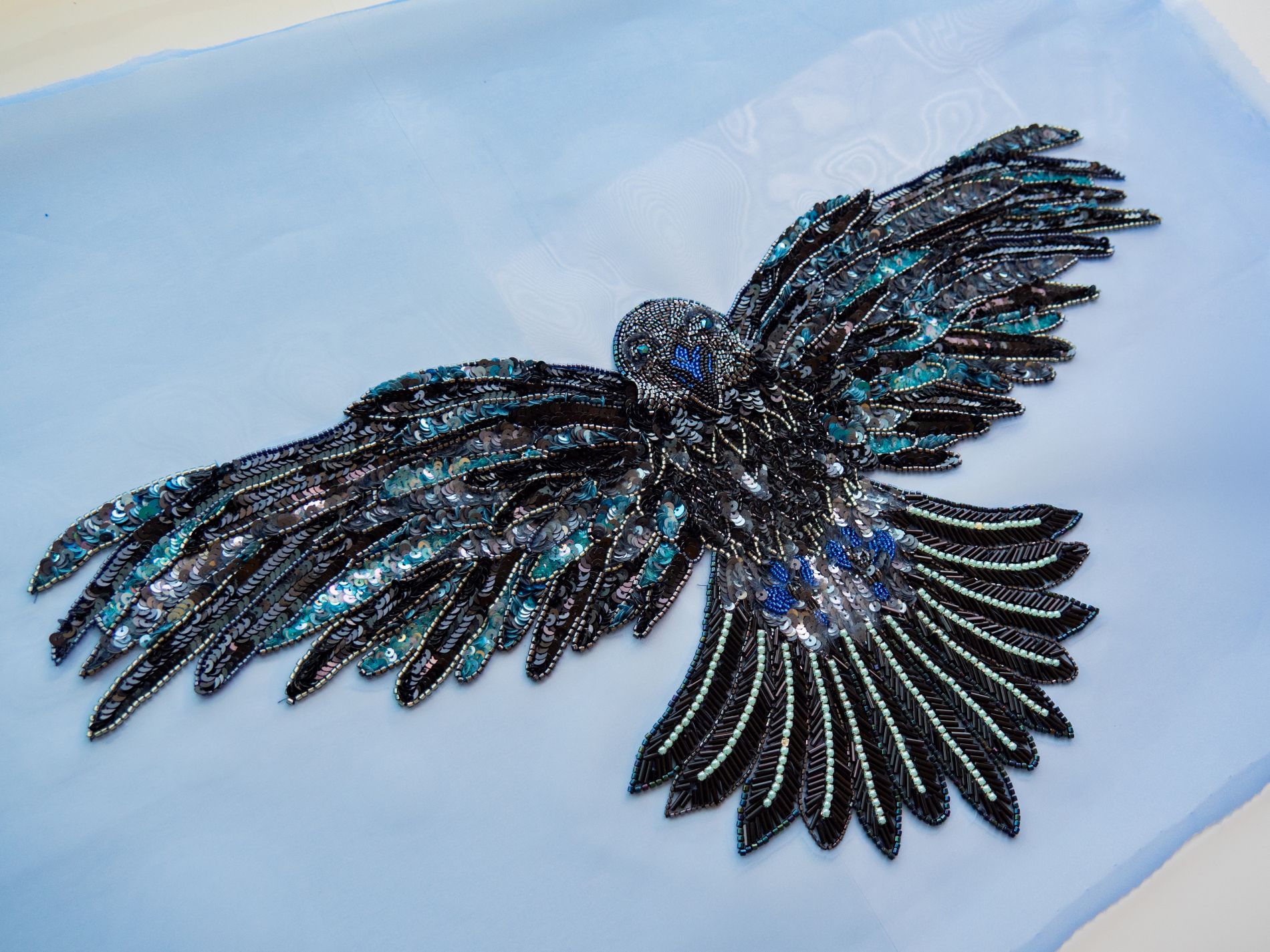 Cosplay Embroidery Commission Nights Watch Sigil Inspired Raven | Ksenia Semirova. Embroidery art Game of Thrones inspired cosplay embroidery commission showing a raven motif with sequins and beads, designed after the Night’s Watch sigil for costume use.