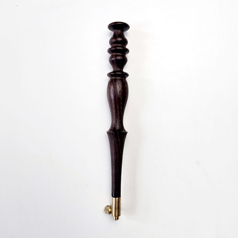 Dark ash tambour hook with chess-inspired turned handle and brass screw fitting, supplied with size 70 needle for Luneville embroidery.
