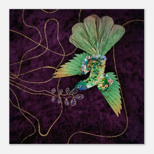 Hummingbird textile art print showing a bird with spread wings against a dark velvet background, featuring layered embroidery details and decorative floral elements.