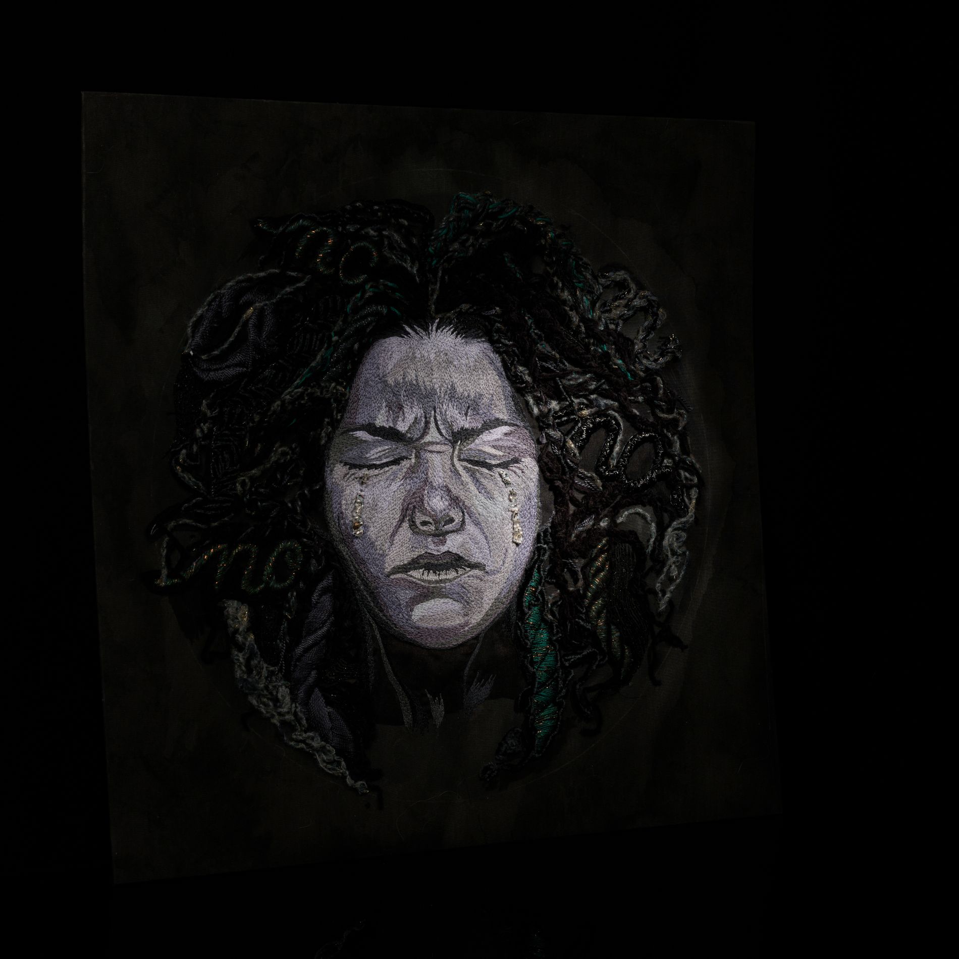 Power of No – Sorrow Hand-Embroidered Textile Artwork Sorrow from the Power of No series, a hand-embroidered textile portrait by Ksenia Semirova.