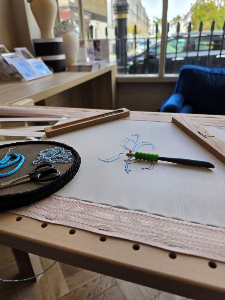 Home 12 Lunéville embroidery frame with tambour hook, scissors, beads and cords at Sewing Academy Pimlico in London.