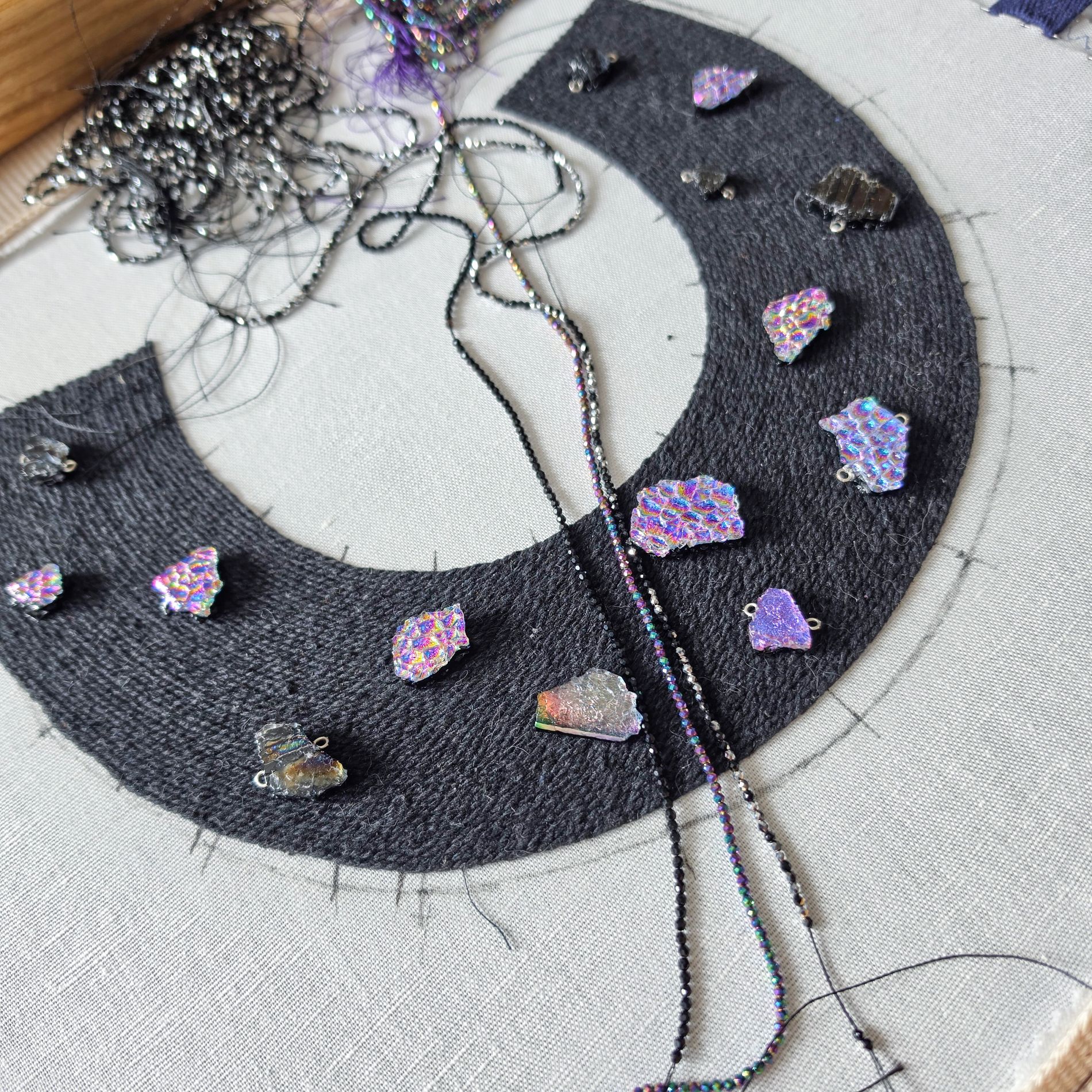 Black To the Moon and Back textile and glass jewellery necklace in progress, with colourful handmade glass elements, beads and hand embroidery.