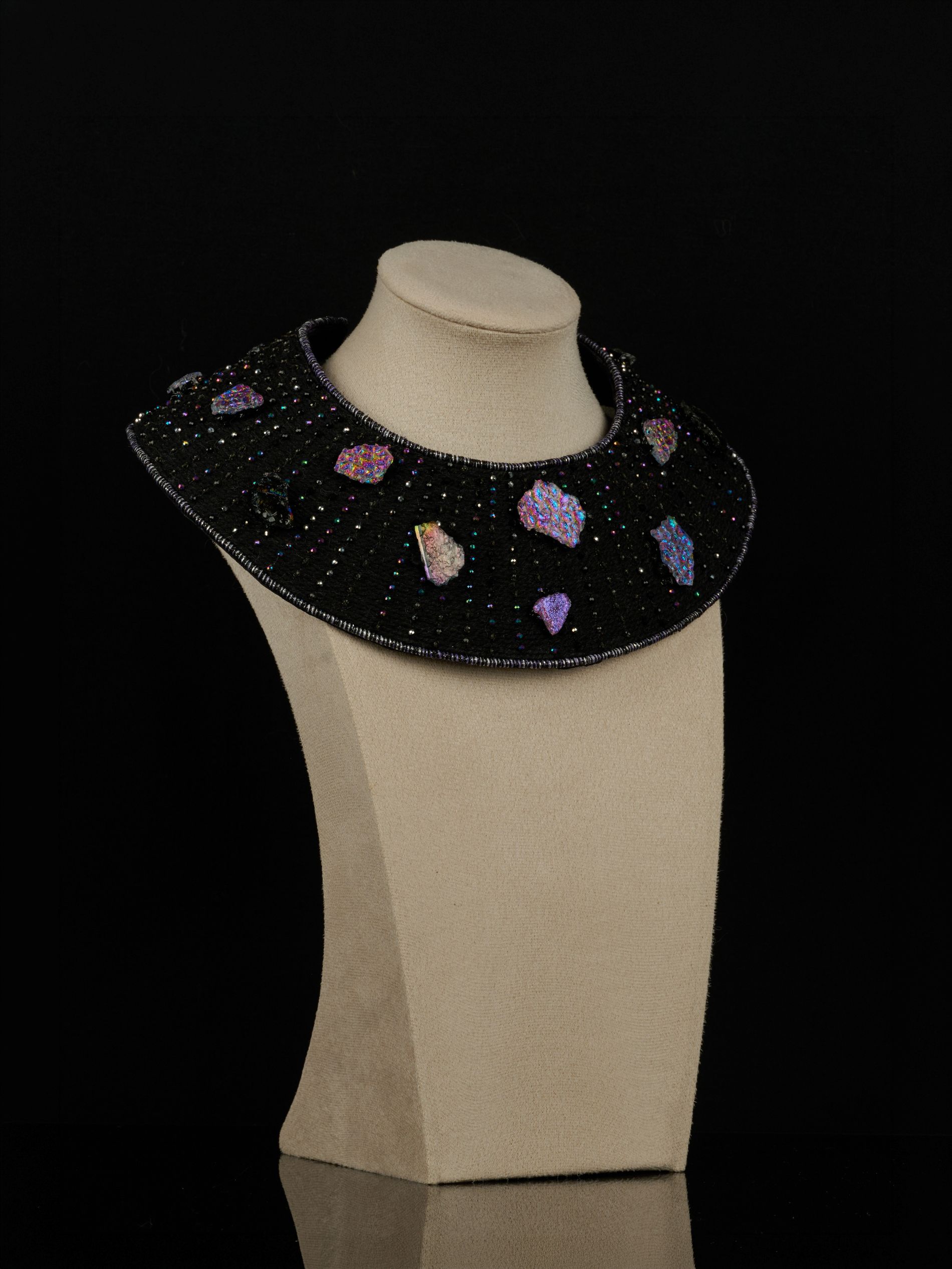 Front view of the black To the Moon and Back necklace with embroidered beadwork and colourful handmade glass elements