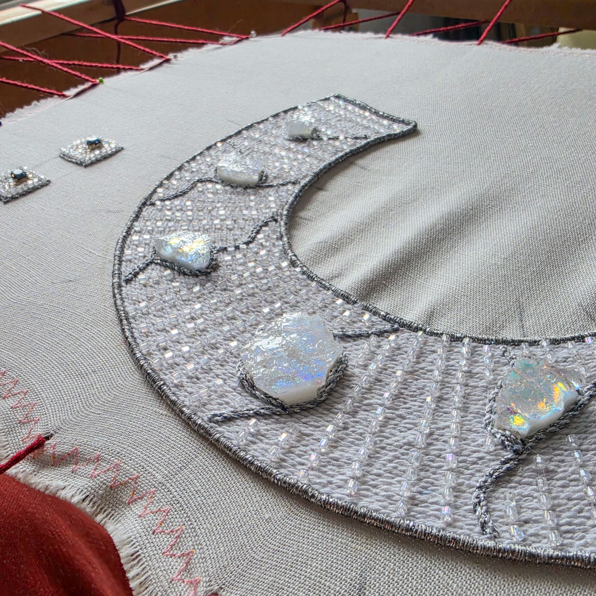 White To the Moon and Back collar necklace in progress with hand embroidery, glass beads and handmade glass elements.